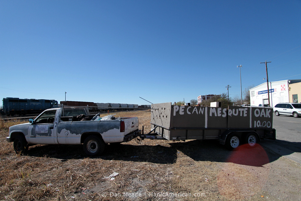 A truck carrying three kinds of wood.