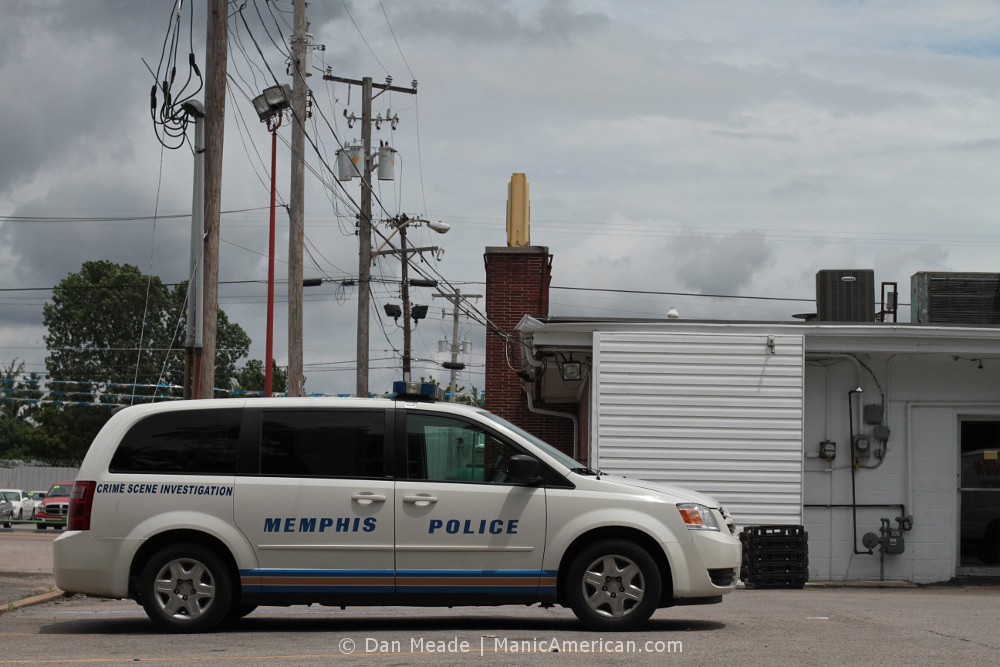 A Memphis Crime Scene Investigation crossover parked behind Tops.
