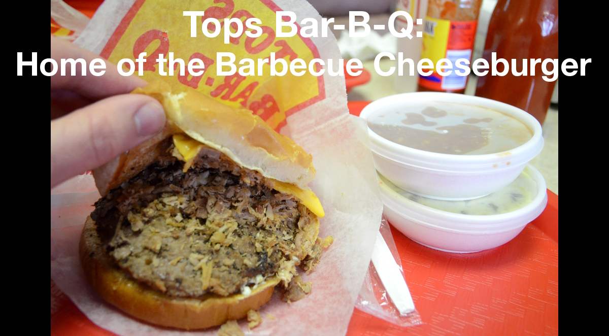 Summary graphic: A cheeseburger with barbecue pork atop it, next to two small dishes of sides.