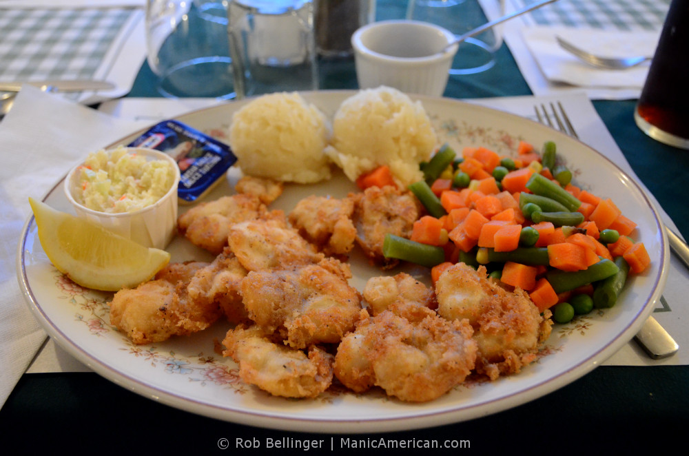 A plate of fried cod tongues with boiled vegetables and cole slaw. Margaree, Newfoundland.