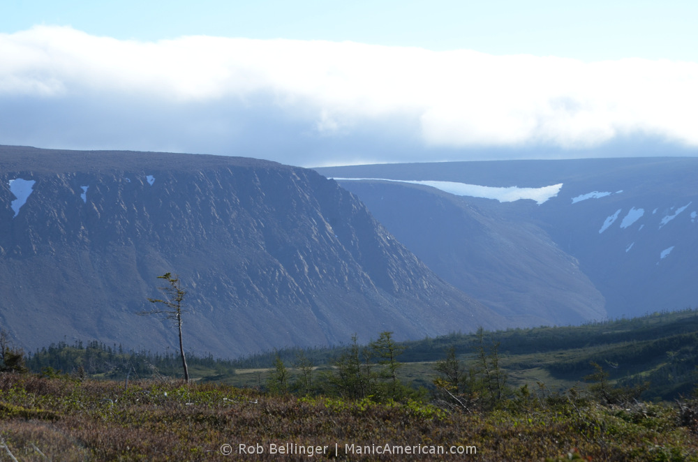 Snow sits atop the tablelands of Gros Morne, rugged, flat-topped mountains. Gros Morne, Newfoundland.