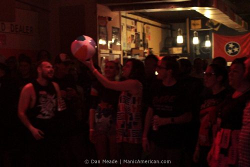 the crowd plays with a beach ball