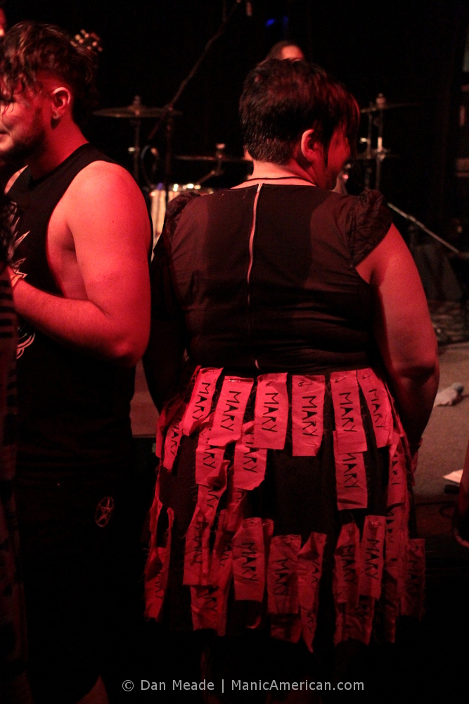 a woman in a home-made dress bearing her name