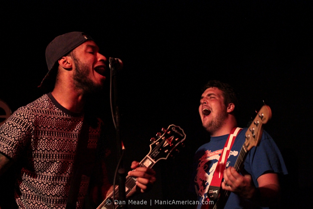 2 shot of Guitarists screaming into the night