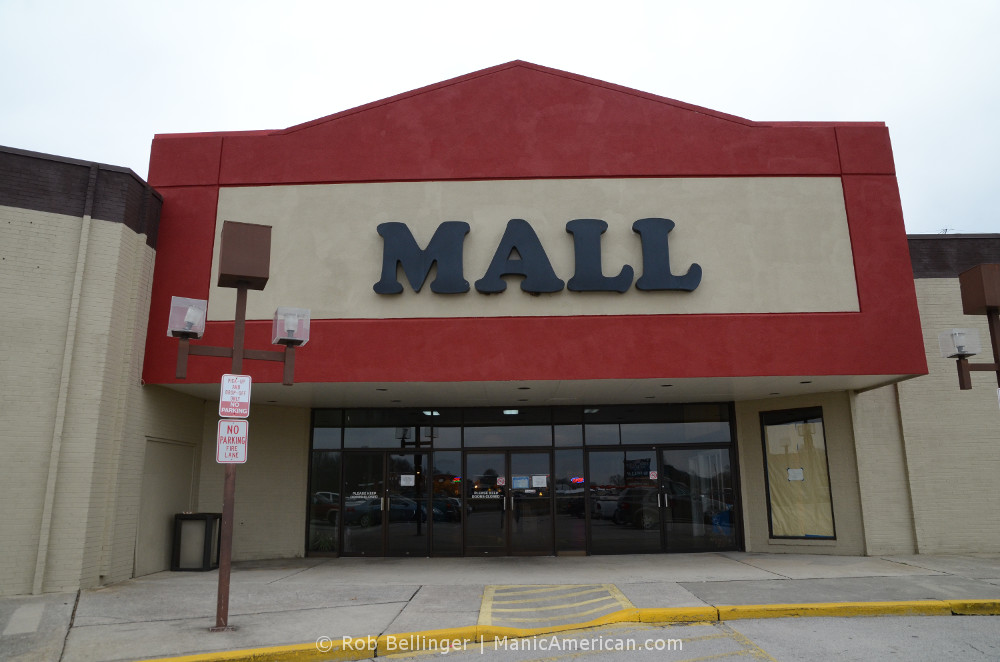 The outside of an old mall says, simply, MALL
