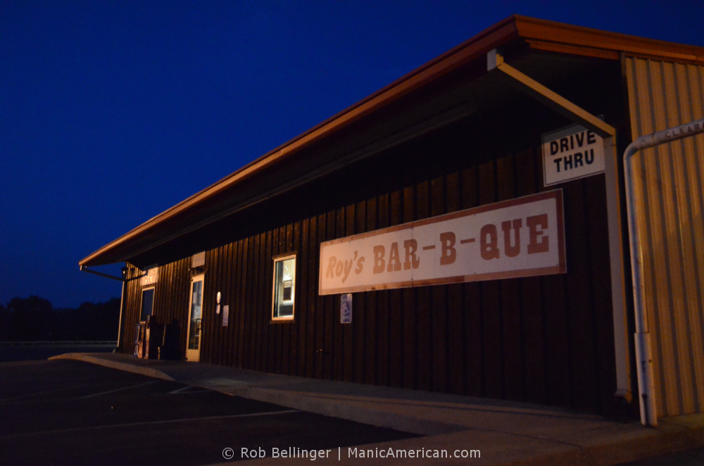 A closed Kentucky barbecue restaurant under a blue night sky