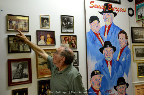 Henry Harrison points to a photo on the wall of the International Rock-a-billy Hall of Fame