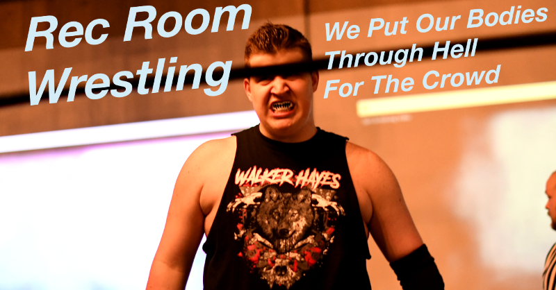 Summary graphic: With the top rope blocking the view of his eyes, Walker Hayes steps into the ring wearing a shirt showing his name in heavy metal font and a wolf surrounded by bloody bones.