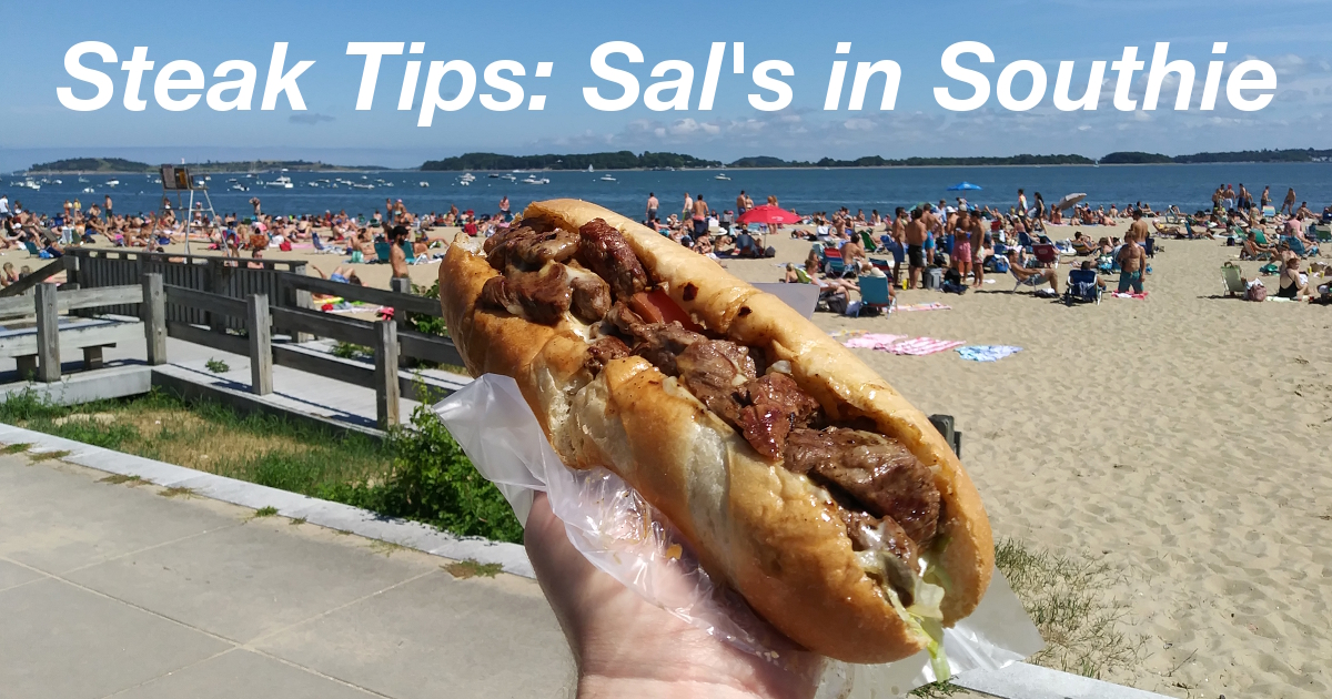 Summary graphic: A steak tip sub sandwich held in front of the small beach along South Boston, MA.