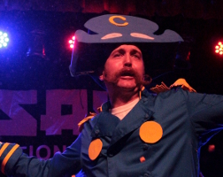 Summary graphic: A man dressed as Cap'n Crunch at the 2012 NYC Beard and Moustache Competition.