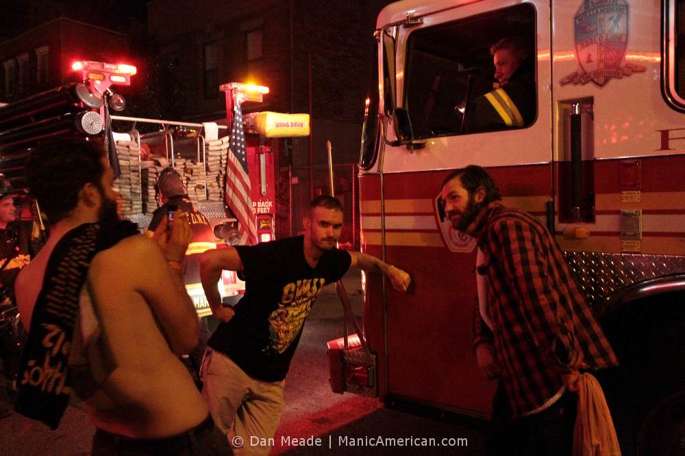 GWAR fans pose in front of a FDNY fire engine.