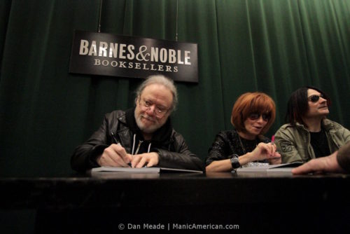 Tommy Ramone signs a book.