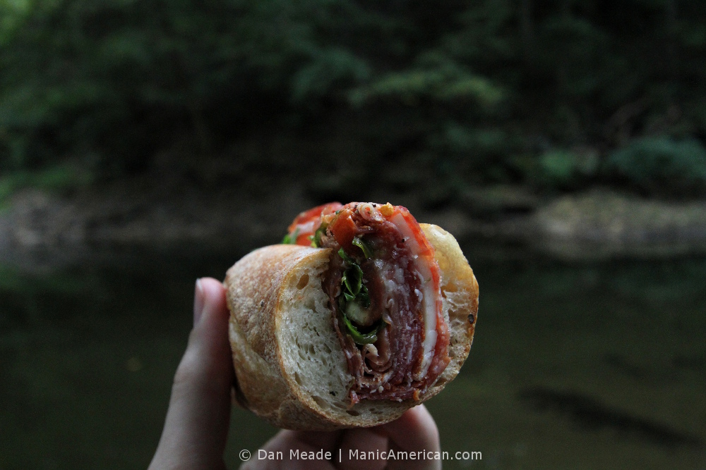 a cross-section of an Italian cold cut sandwhich