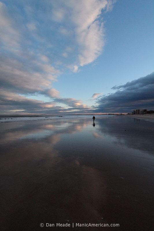 A cloudy sky reflected over the shore of Old Orchard Beach.