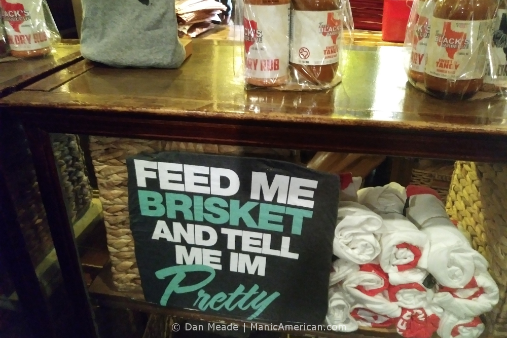 A souvenir t-shirt that reads, "FEED ME BRISKET AND TELL ME I'M PRETTY"