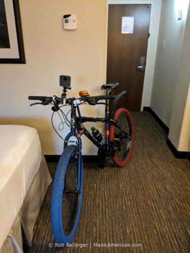 a bike with red and blue tires in a hotel room