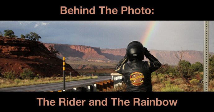 Summary graphic: A helmeted motorcycle rider takes a photo of a rainbow arcing over a vista of red rocks and buttes.